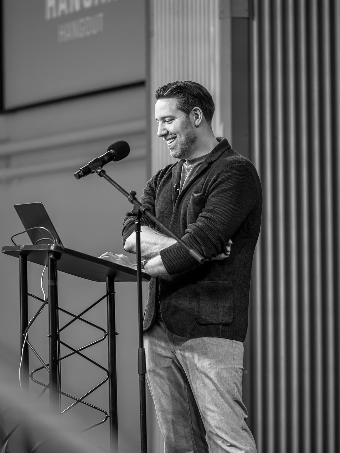 Colin Cox at the podium during a Hangar Hangout session in Vancouver